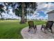 Brick patio with two rocking chairs and a view of the golf course at 2515 Nw 53Rd Avenue Rd, Ocala, FL 34482