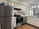 Kitchen with stainless steel appliances and light wood cabinets at 4852 Sw 144Th St, Ocala, FL 34473