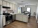 Kitchen with stainless steel appliances and light wood cabinets at 4852 Sw 144Th St, Ocala, FL 34473