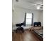 Well-lit bedroom with a crib, stroller, and plenty of room at 4852 Sw 144Th St, Ocala, FL 34473