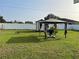 Backyard with gazebo, shed, and spacious grassy area at 4852 Sw 144Th St, Ocala, FL 34473