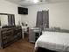 Spacious bedroom with large bed, dresser, and plenty of natural light at 4852 Sw 144Th St, Ocala, FL 34473