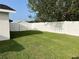 Backyard with a white vinyl fence and double gate at 4852 Sw 144Th St, Ocala, FL 34473