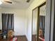 Simple bedroom with a large mirror and lots of storage space at 4852 Sw 144Th St, Ocala, FL 34473