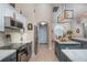 Modern kitchen with stainless steel appliances and granite countertops at 10411 Sw 52Nd Ct, Ocala, FL 34476