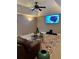 Spacious Gathering room with a large TV, comfortable seating, and a ceiling fan at 10411 Sw 52Nd Ct, Ocala, FL 34476