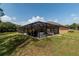 Screened pool enclosure with patio and grilling area at 10411 Sw 52Nd Ct, Ocala, FL 34476
