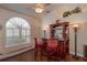 Wet bar with cabinetry and two barstools at 10411 Sw 52Nd Ct, Ocala, FL 34476