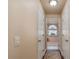 Bright bathroom hallway with access to multiple rooms at 10411 Sw 52Nd Ct, Ocala, FL 34476