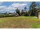 Large backyard with shed and lush lawn at 10411 Sw 52Nd Ct, Ocala, FL 34476