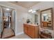 Bathroom with single vanity and view into bedroom at 10411 Sw 52Nd Ct, Ocala, FL 34476