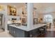 Modern kitchen with a large island, stainless steel appliances, and granite countertops at 10411 Sw 52Nd Ct, Ocala, FL 34476