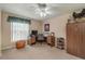 Home office with desk, chair, and built-in shelving at 10411 Sw 52Nd Ct, Ocala, FL 34476