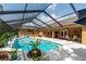 Expansive screened pool and patio area perfect for entertaining at 10411 Sw 52Nd Ct, Ocala, FL 34476