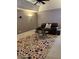 Spacious Gathering room with a large TV, comfortable seating, and a ceiling fan at 10411 Sw 52Nd Ct, Ocala, FL 34476