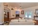 Spacious living room with fireplace and access to pool at 10411 Sw 52Nd Ct, Ocala, FL 34476