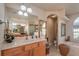 Elegant bathroom with dual vanities and a soaking tub at 10411 Sw 52Nd Ct, Ocala, FL 34476