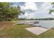 Private lake access with a wooden dock and sandy launch area at 22645 Ne 105Th Avenue Rd, Fort Mc Coy, FL 32134