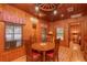 Rustic dining area featuring a wooden table and lake view at 22645 Ne 105Th Avenue Rd, Fort Mc Coy, FL 32134