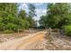 Long driveway leading to a green house at 22649 Ne 105Th Avenue Rd, Fort Mc Coy, FL 32134