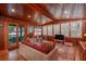 Living room with wood walls, comfortable seating, and water views at 22649 Ne 105Th Avenue Rd, Fort Mc Coy, FL 32134