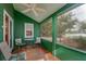 Screened porch overlooking the lake with wooden chairs at 22649 Ne 105Th Avenue Rd, Fort Mc Coy, FL 32134
