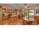 Kitchen with wood cabinets, island, and stainless steel appliances at 22649 Ne 105Th Avenue Rd, Fort Mc Coy, FL 32134