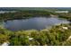 Stunning aerial view showcasing waterfront property and lake access at 22649 Ne 105Th Avenue Rd, Fort Mc Coy, FL 32134