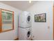Laundry room with stacked washer and dryer at 22649 Ne 105Th Avenue Rd, Fort Mc Coy, FL 32134