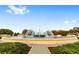 Community fountain with surrounding landscaping at 9423 Se 130Th Street Rd, Summerfield, FL 34491