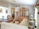 Bright living room with hardwood floors, hutch, and comfortable seating area at 5958 Sw 102Nd Ln, Ocala, FL 34476