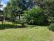 Spacious backyard with lush greenery and mature trees at 5958 Sw 102Nd Ln, Ocala, FL 34476