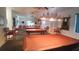 Well-lit game room featuring multiple pool tables at 5958 Sw 102Nd Ln, Ocala, FL 34476