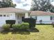 Charming one-story home with well manicured landscaping and attached garage at 5958 Sw 102Nd Ln, Ocala, FL 34476