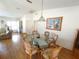 Dining room features a glass-top table surrounded by six chairs at 5958 Sw 102Nd Ln, Ocala, FL 34476