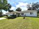 Ranch style home features a spacious yard and attached garage at 5958 Sw 102Nd Ln, Ocala, FL 34476
