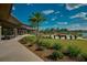 Community clubhouse with outdoor seating, fire pit, and lush landscaping at 3369 Nw 52Nd Avenue Rd, Ocala, FL 34482