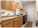 Laundry room with washer, dryer, and cabinets at 3051 Sw 41St Pl, Ocala, FL 34474