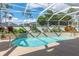 Inviting kidney-shaped pool with a screened enclosure at 3051 Sw 41St Pl, Ocala, FL 34474