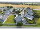 Aerial view of house with a screened in pool and backyard at 3051 Sw 41St Pl, Ocala, FL 34474