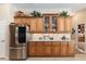 Kitchen with wood cabinets and stainless steel refrigerator at 3051 Sw 41St Pl, Ocala, FL 34474