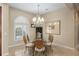 Formal dining room with a glass table and chandelier at 3051 Sw 41St Pl, Ocala, FL 34474