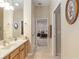 Clean bathroom with double vanity and access to bedroom at 3051 Sw 41St Pl, Ocala, FL 34474