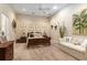 Comfortable bedroom with sitting area and large artwork at 3051 Sw 41St Pl, Ocala, FL 34474