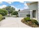 House exterior with landscaping and a partial view of the street at 3051 Sw 41St Pl, Ocala, FL 34474