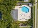 Aerial view of community pool with surrounding lounge chairs and patio at 3051 Sw 41St Pl, Ocala, FL 34474