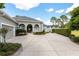 House exterior showcasing landscaping and a large driveway at 3051 Sw 41St Pl, Ocala, FL 34474