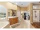 Bathroom with double vanity, walk-in closet, and access to other rooms at 3051 Sw 41St Pl, Ocala, FL 34474