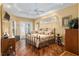Main bedroom with hardwood floors and access to the patio at 3051 Sw 41St Pl, Ocala, FL 34474