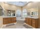 Large bathroom with double vanity, soaking tub, and separate shower at 3051 Sw 41St Pl, Ocala, FL 34474